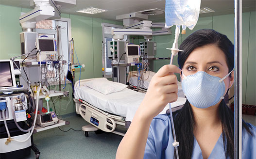female nurse in face mask checking IV fluids in hospital room